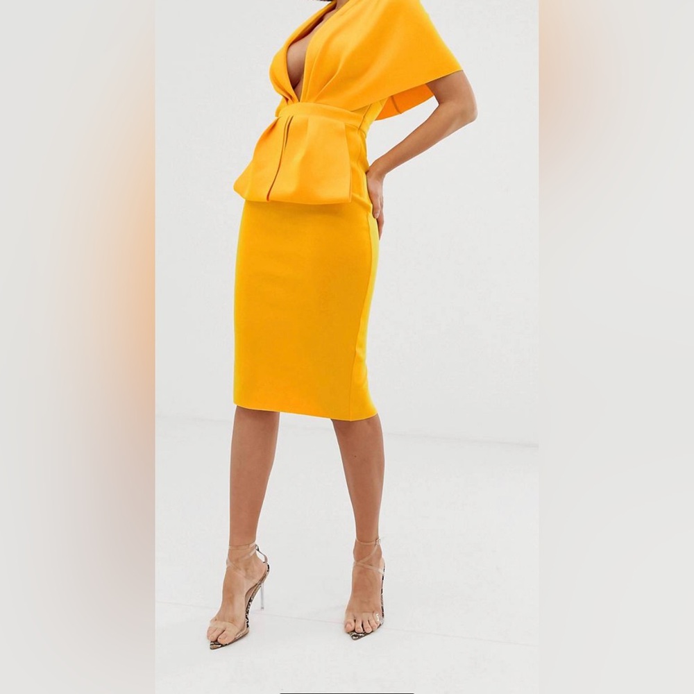 Beautiful body hugging dress. Flounce London drape front mini dress.